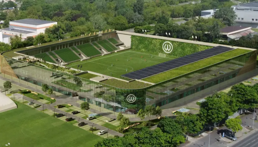 Nowoczesny stadion Warty Poznań z zielonymi dachami, panele słoneczne i pionowy ogród na ścianie.