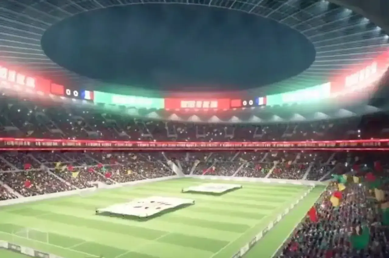 Widok na pełne trybuny stadionu, gdzie kibice wznoszą flagi. Na telebimach widać wynik 00. To z pewnością najładniejszy stadion na świecie.